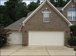 performing a visual inspection of your garage door