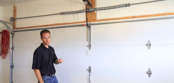 man explaining garage door maintenance